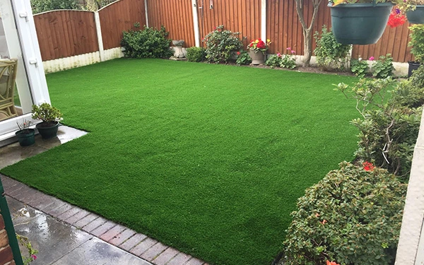 What do you put under artificial grass?