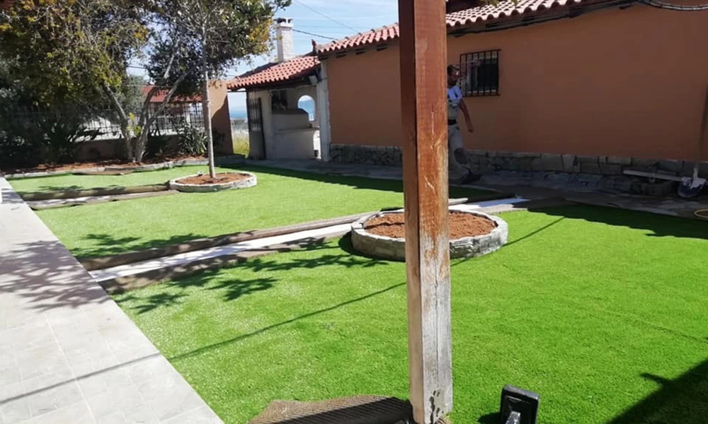 What do you put under artificial grass?