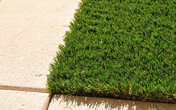 Will artificial grass smell after it rains?