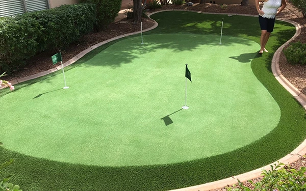 How do I put a golf green in my backyard?