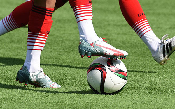 Is artificial turf easily damaged when playing football?