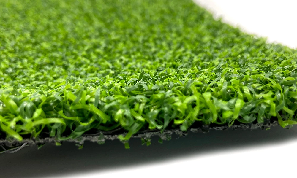 What kind of artificial grass is used in cricket pitches?