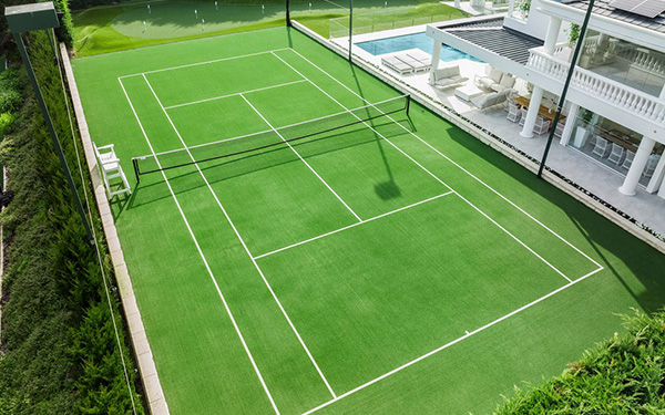 What is an artificial turf tennis court? Its advantage?