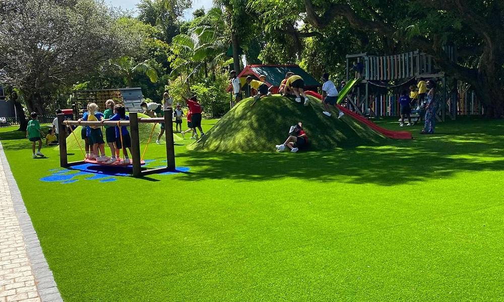 What do you put under artificial turf for a playground?