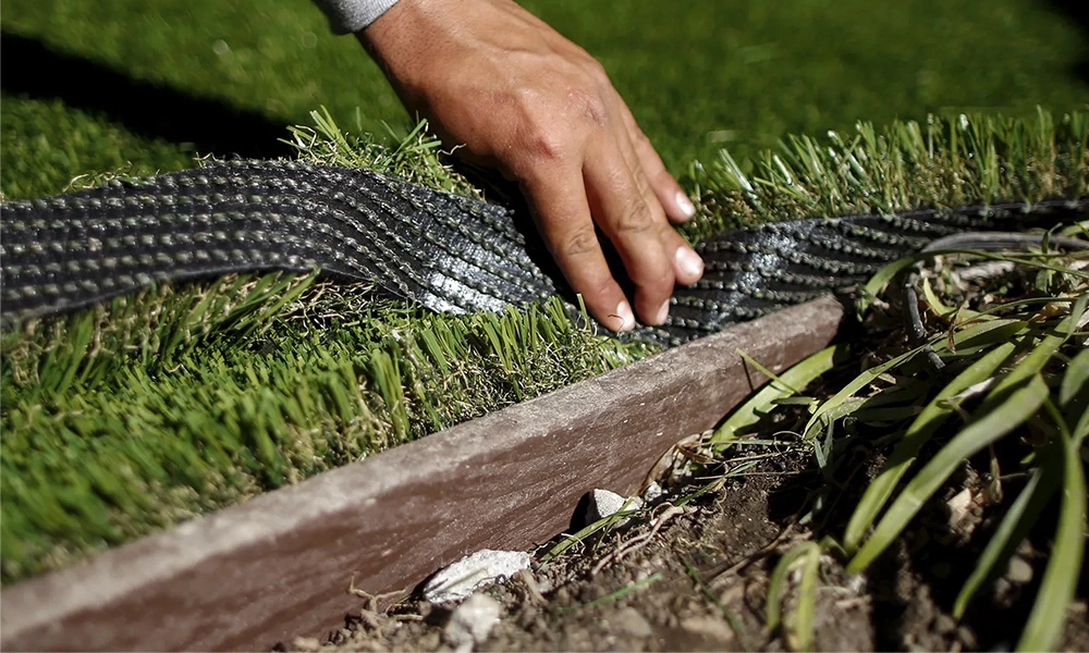 What do you put under artificial turf for a playground?